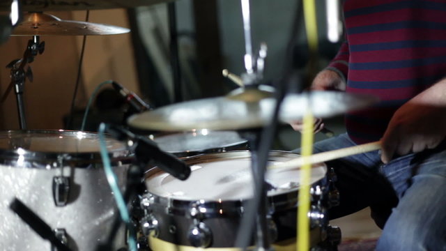 close up shot of musican playing drums