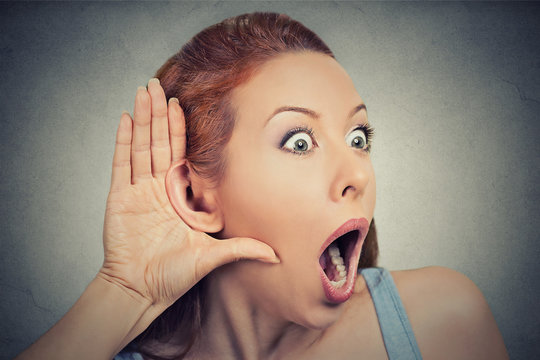 nosy shocked woman listening eavesdropping grey background 