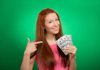 woman showing holding money dollar bills on green background  