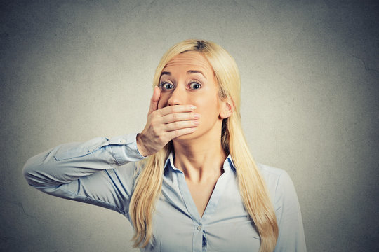 Shocked woman forced to cover her mouth with hand