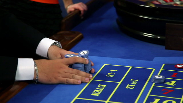 Young couple winning at roulette table