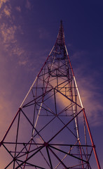 High-voltage tower against blue sky.