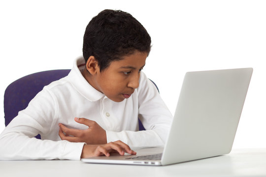 Hispanic Boy Studying with Laptop on White Background