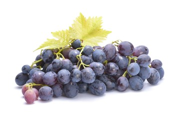 Red grape with green leaf, isolated on white