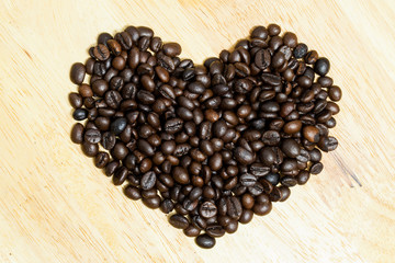 Coffee bean on wooden background.