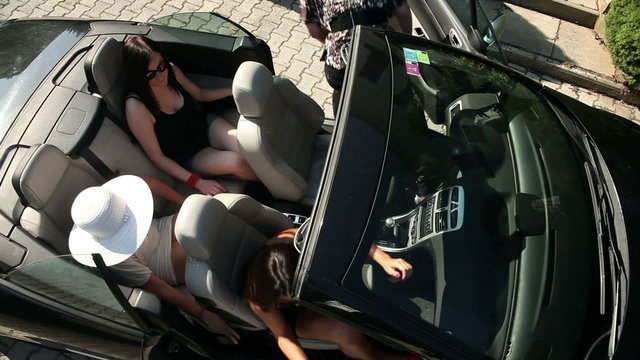 Shot From Bird Perspecitve Of Women Getting Out Of The Car