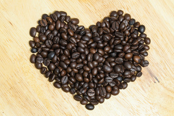 Coffee bean on wooden background.