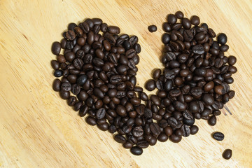 Coffee bean on wooden background.