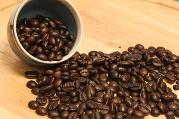 Coffee bean on wooden background.