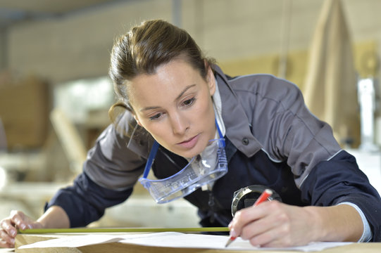 Young woman in carpentry professional training