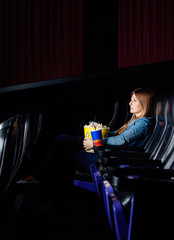 Woman Watching Movie At Cinema Theater © Tyler Olson
