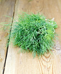Dill on wooden board