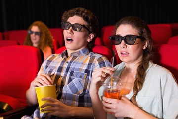 Young couple watching a 3d film