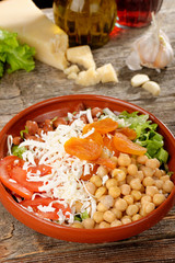 Salad with chickpeas, tomato, cheese and dried apricots