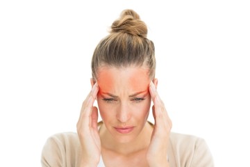 Woman with headache touching her temples