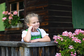 Portrait of little girl wearing a traditional Bavarian dress
