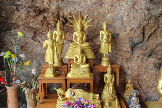 golden buddha image in the cave