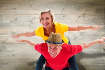 Composite image of mature couple joking about together