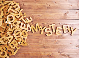 Word mystery made with wooden letters