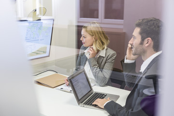 Two business peoples working together in meeting room