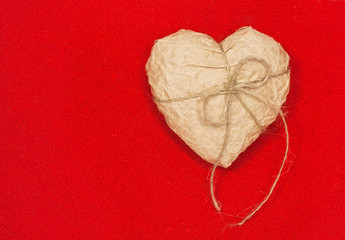 paper heart on red background