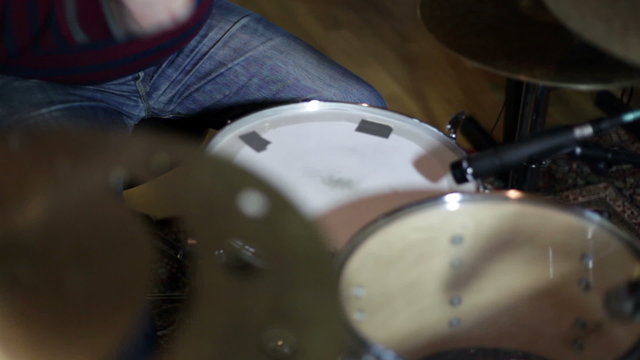 close up shot of musican playing drums