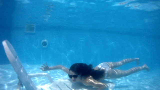 Swimming in the pool.