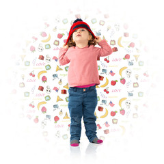 Little girl putting on a Christmas hat