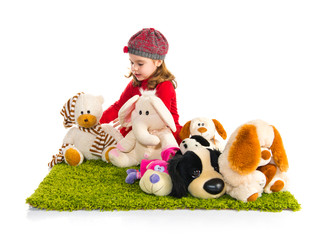 Little girl playing with stuffed animals