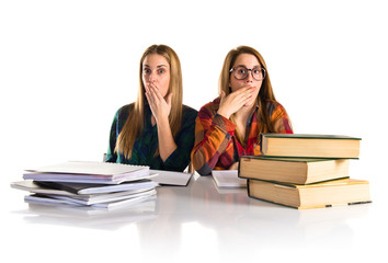 Surprised friends studying together