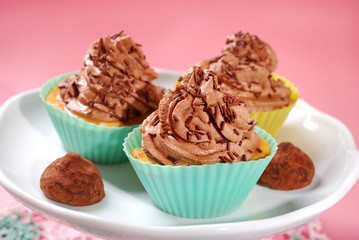 cupcakes with truffle cream and chocolate sprinkles