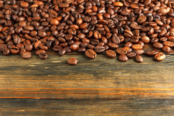 Coffee beans on wood close-up