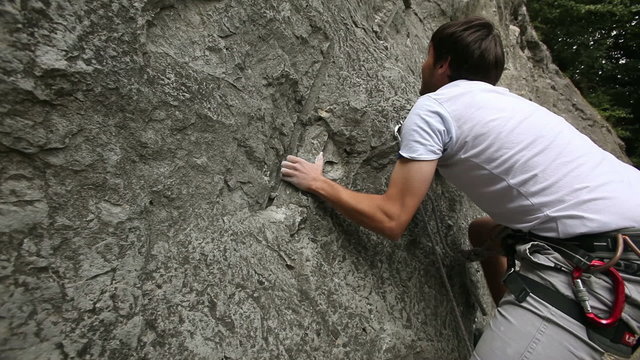 HD1080p: Young man starting to rock climb