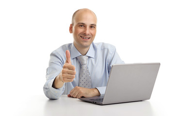 business man working at the laptop with thumb up gesture