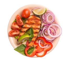 Grilled salmon steak on plate isolated on white background.