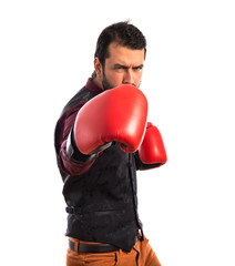 Man wearing waistcoat with boxing gloves