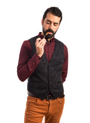 Naklejka premium Man wearing waistcoat smoking