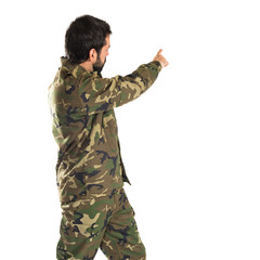 Soldier pointing back