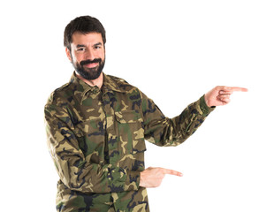 Soldier pointing to the lateral