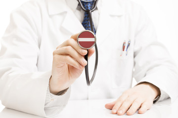 Doctor holding stethoscope with flag series - Latvia