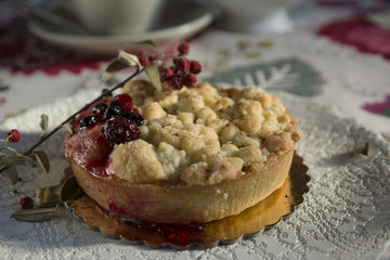 Delicious homemade cherry pie on floral tablecloth