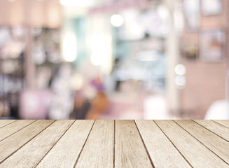 Perspective wood and blurred cafe with bokeh light background