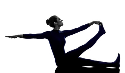 woman exercising Krounchasana heron pose yoga silhouette