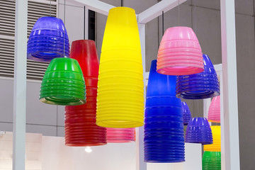 colorful round stylish lampshades hang from ceiling