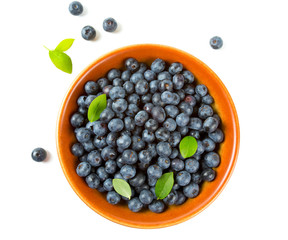 blueberries in a clay bowl