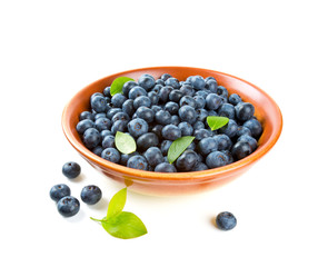 blueberries in a clay bowl