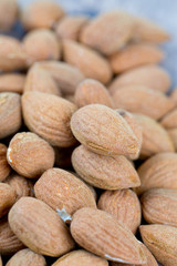 almond nuts on wooden surface