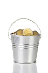 bucket with silver coins. Isolated.