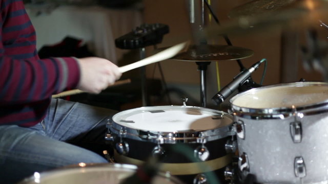 close up shot of musican playing drums
