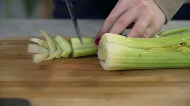 Slicing celery to use it as ingredient for smoothie